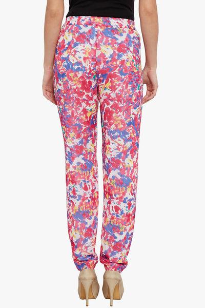 Trousers in fuchsia print with side pockets detail